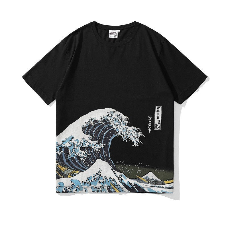 Black t-shirt with an ocean wave illustration on the lower front, flat lay, front view