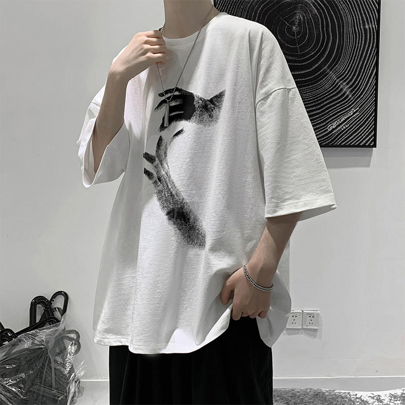 White oversized t-shirt with a reaching-hands graphic on the front, worn by a model, front view
