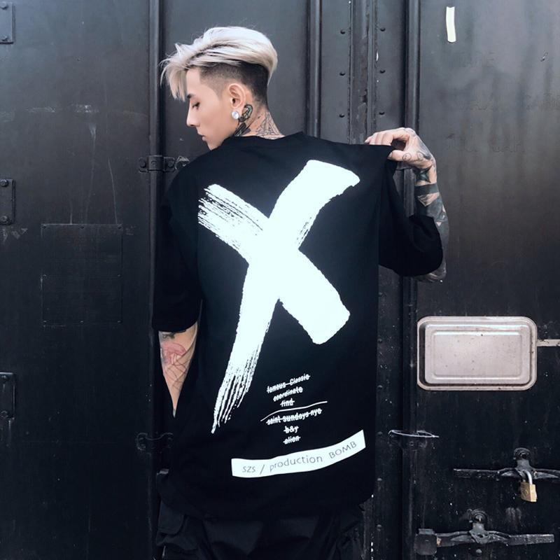 Black with White Print loose t-shirt with a large brush-stroke X on the back, back view