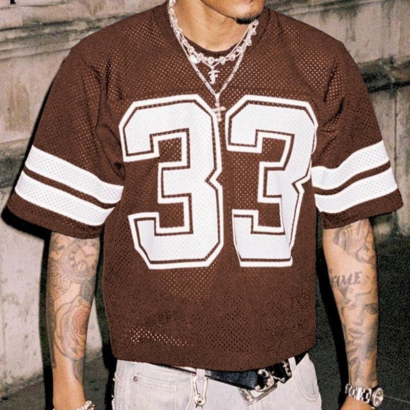 Brown mesh sports t-shirt with a large number 33 and sleeve stripes, worn by a model, front view