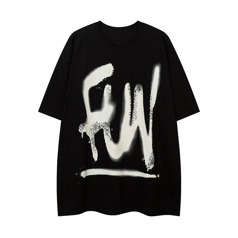 Black t-shirt with a large spray graffiti print on the chest, flat lay, front view