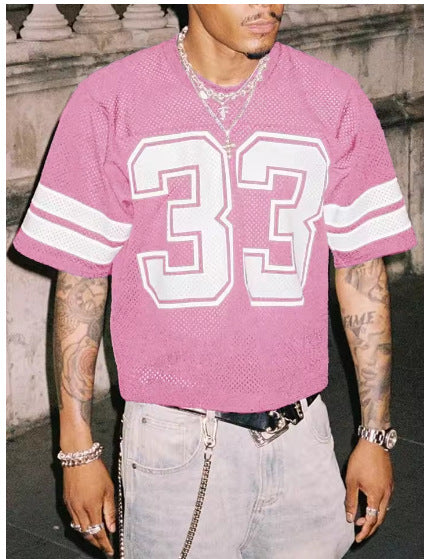 Dusty Pink mesh sports t-shirt with a large number 33 and sleeve stripes, worn by a model, front view