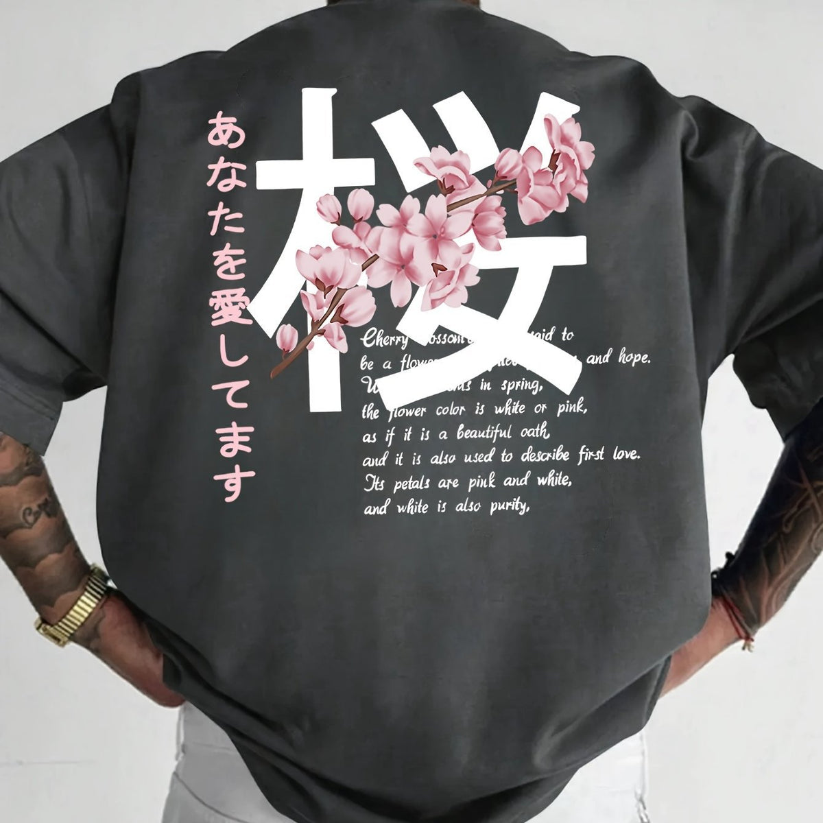 Charcoal loose t-shirt with a cherry blossom graphic on the back, back view