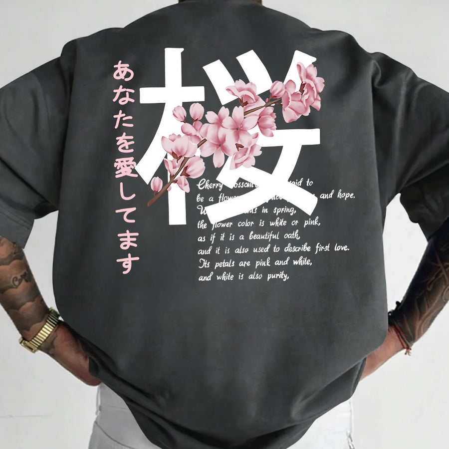 Charcoal loose t-shirt with a cherry blossom graphic on the back, back view