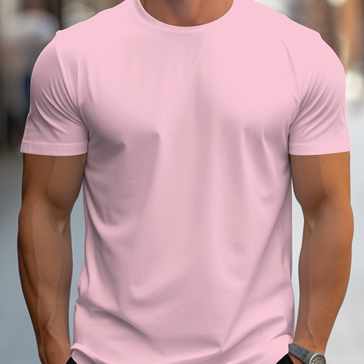 Pink plain crew-neck t-shirt, worn by a model, front view