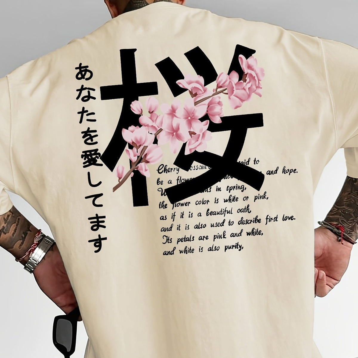 Cream loose t-shirt with a cherry blossom graphic on the back, back view